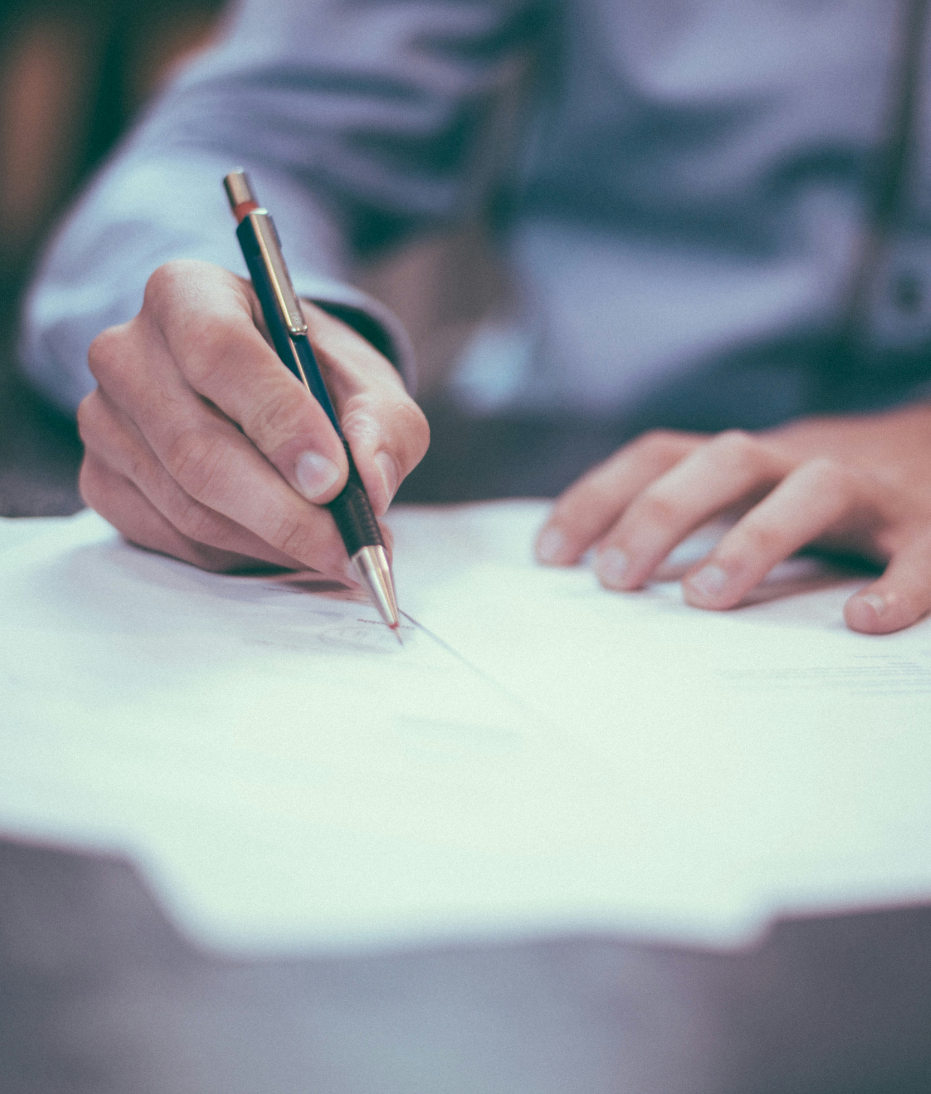 A close up of a pen writing on a piece of paper